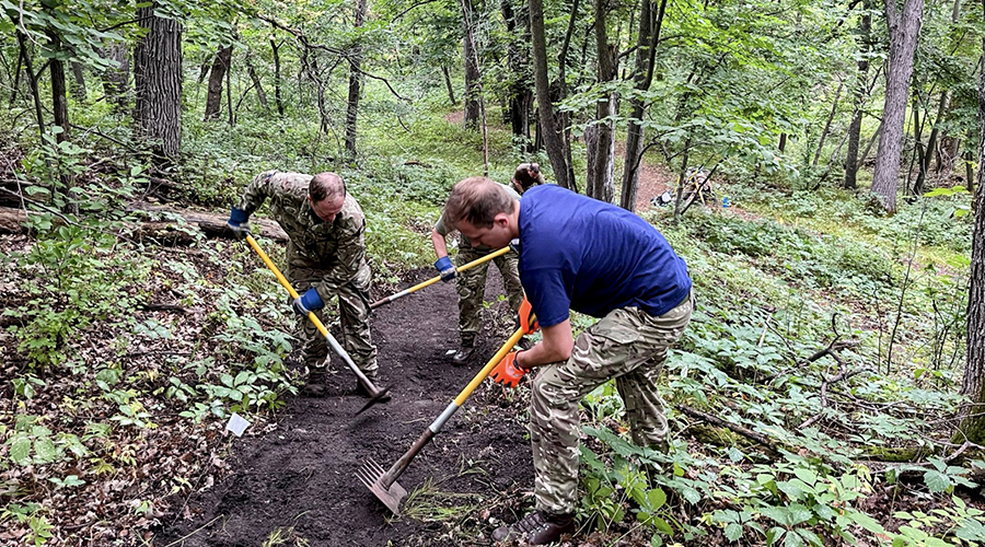 Volunteers perform trail maintenance