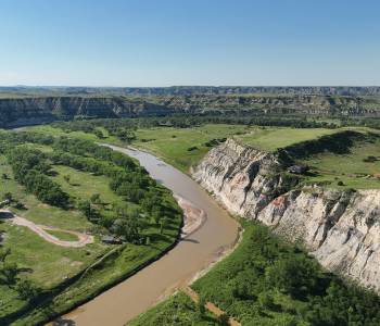 Aerial view of badlands bluffs along the Little Missouri River